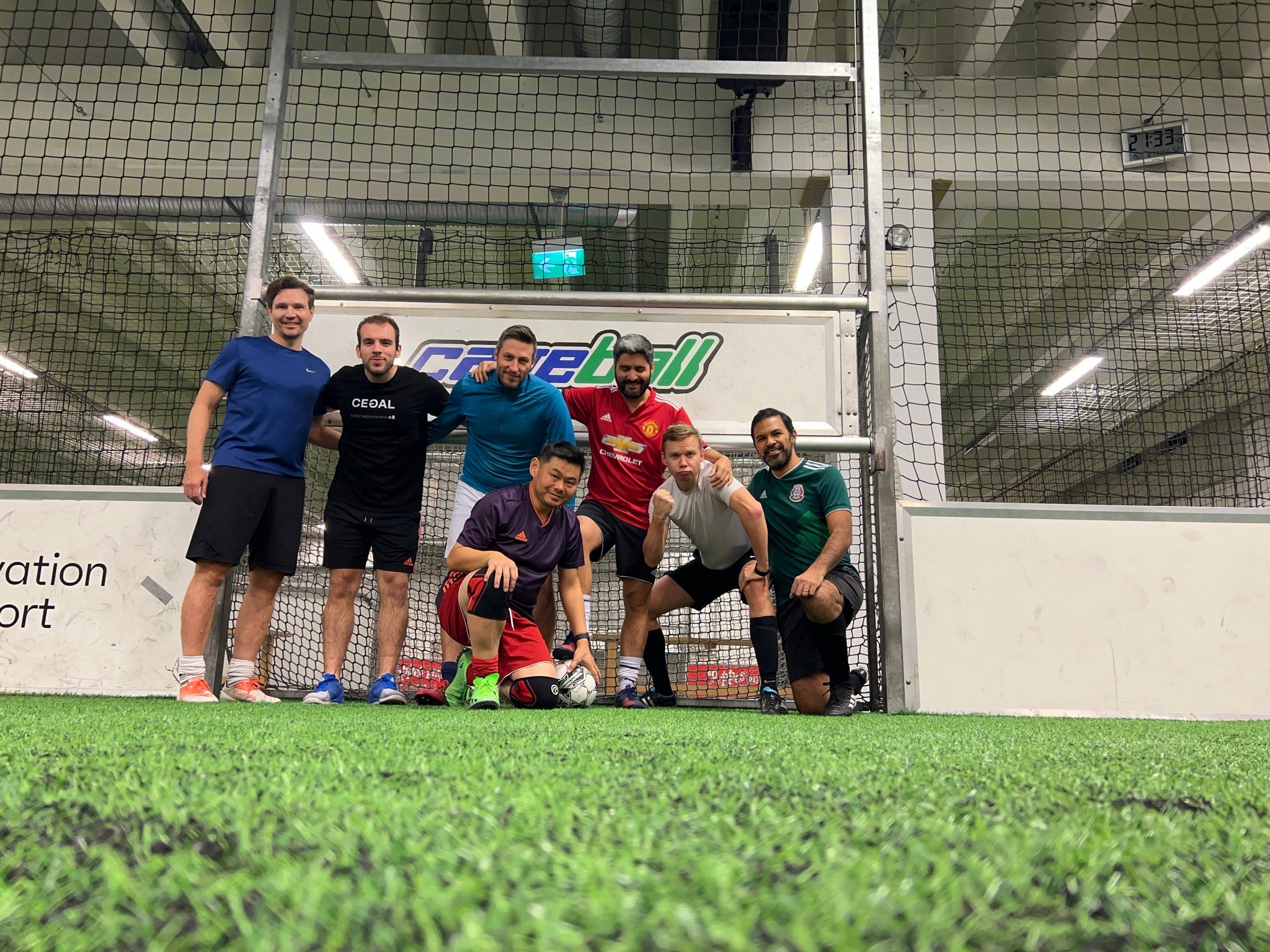 A group of guys playing Cageball