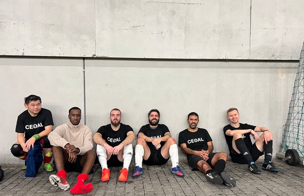 A group of guys playing soccer