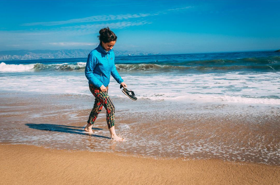 Woman walking along the beach